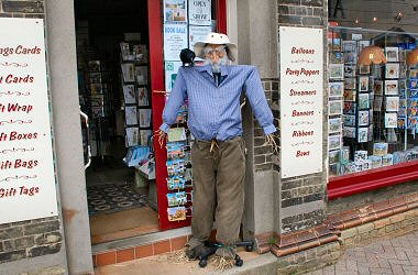 Scarecrow plus Crow outside Fox's Cards and Gifts shop