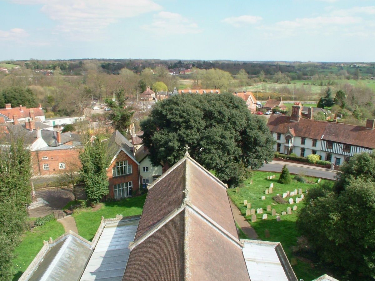 On a sunny day in May 2009 Tim took the Blythweb camera to the top of the tower of St Mary’s Church in Halesworth. Our thanks go to the PCC for giving their permission and to Doug Crooks for his cheerful and knowledgeable assistance on the day.<br>
<br>
Looking along the ridge of St.Mary’s Church across to the buildings at Angel Link with the Town Park trees not quite yet in full leaf to the left. On the right is part of <a href=\